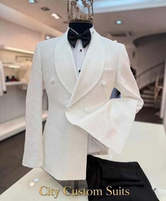 White shawl-lapel dinner jacket with black bow tie